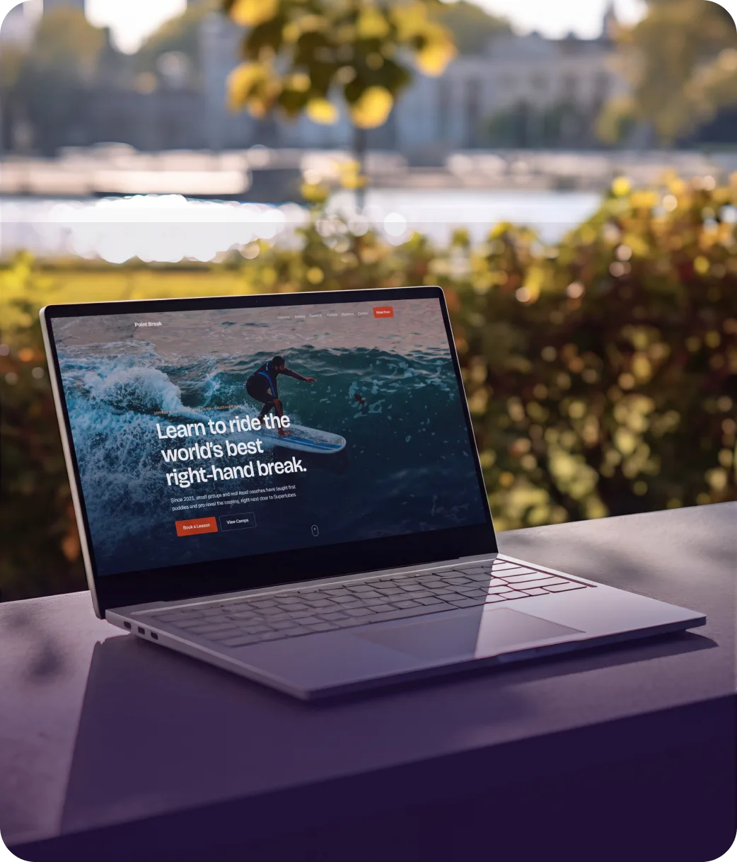 The Point Break Surf Academy website on a laptop